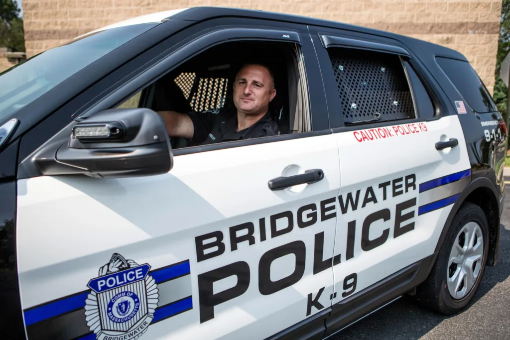 Police Officer Sitting in a police car.