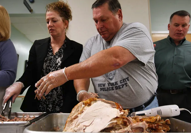 Retired Bridgewater Police Sgt. Ron Piche carbes turkey and prepares it for Laurie Guerrini to serve at the annual dinner for seniors.